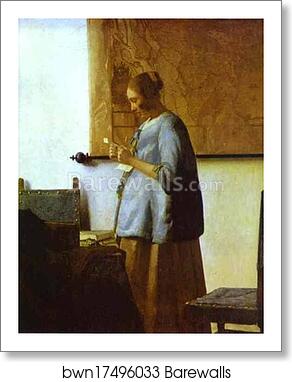 woman in blue reading a letter