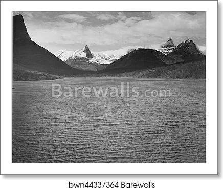 Looking across toward snow-capped mountains, lake in foreground, "St. Mary's Lake, Glacier National Park," Montana.  Photographs of National Parks and Monuments, compiled 1941 - 1942, documenting the period ca. 1933 - 1942 by Ansel Adams (1902-1984), Art Print