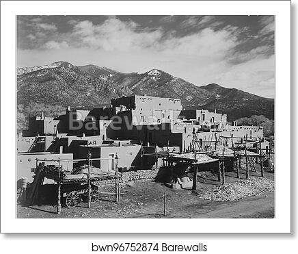 Full view of city, mountains in background, "Taos Pueblo National Historic Landmark, New Mexico, 1941.".  Photographs of National Parks and Monuments, compiled 1941 - 1942, documenting the period ca. 1933 - 1942 by Ansel Adams (1902-1984), Art Print