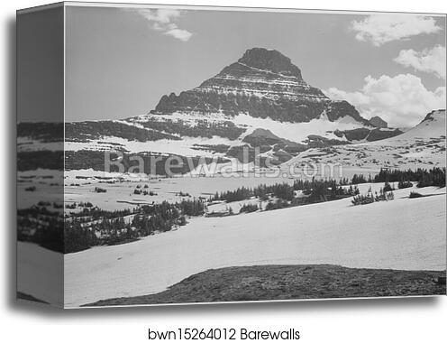 Looking across barren land to mountains, "From Logan Pass, Glacier National Park," Montana.  Photographs of National Parks and Monuments, compiled 1941 - 1942, documenting the period ca. 1933 - 1942 by Ansel Adams (1902-1984), Canvas Print