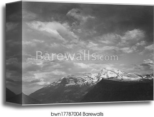 Dark foreground and clouds, mountains highlighted, "Heaven's Peak," Glacier National Park, Montana.  Photographs of National Parks and Monuments, compiled 1941 - 1942, documenting the period ca. 1933 - 1942 by Ansel Adams (1902-1984), Canvas Print