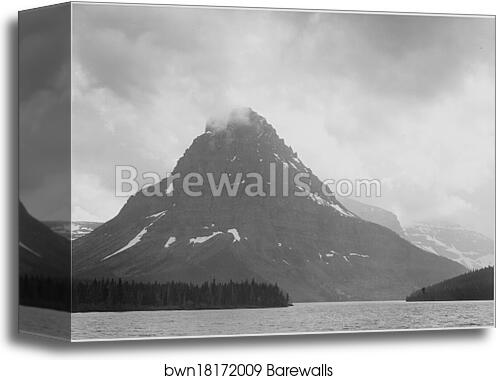 High, lone mountain peak, lake in foreground, "Two Medicine Lake. Glacier National Park," Montana.  Photographs of National Parks and Monuments, compiled 1941 - 1942, documenting the period ca. 1933 - 1942 by Ansel Adams (1902-1984), Canvas Print