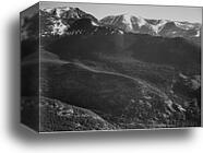 View of wooded hills with mountains in background, "In Rocky Mountain National Park," Colorado.  Photographs of National Parks and Monuments, compiled 1941 - 1942, documenting the period ca. 1933 - 1942 by Ansel Adams (1902-1984), Canvas Print