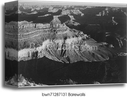 View, dark shadows in foreground and right, framing cliffs at left and center, "Grand Canyon National Park," Arizona.  Photographs of National Parks and Monuments, compiled 1941 - 1942, documenting the period ca. 1933 - 1942 by Ansel Adams (1902-1984), Canvas Print