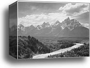 View from river valley towards snow covered mountains, river in foreground from left to right, "Grand Teton" National Park, Wyoming.  Photographs of National Parks and Monuments, compiled 1941 - 1942, documenting the period ca. 1933 - 1942 by Ansel Adams (1902-1984), Canvas Print